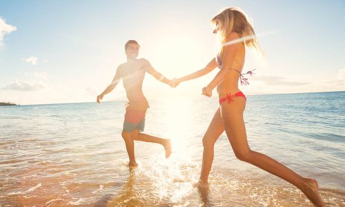 Happy Couple Running on Tropical Beach at Sunset, Vacation